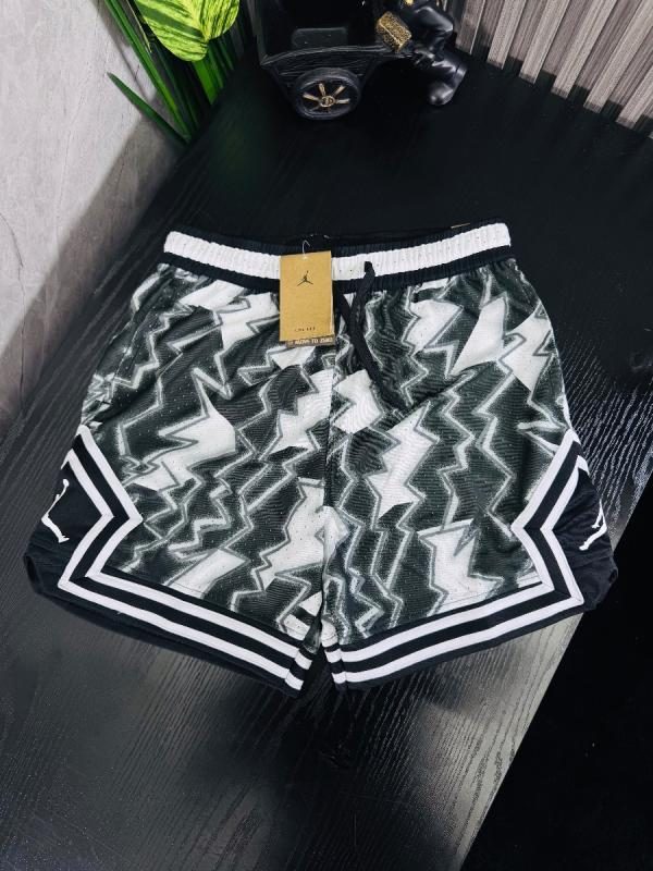 PANTALONETA JORDAN 1.1. RAYOS GRIS CON BLANCO